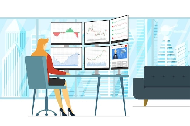 A person sitting at a desk with multiple monitors displaying stock market charts and financial data. They are pointing at one of the screens with a focused expression. Pens, notebooks, and a calculator are on the desk