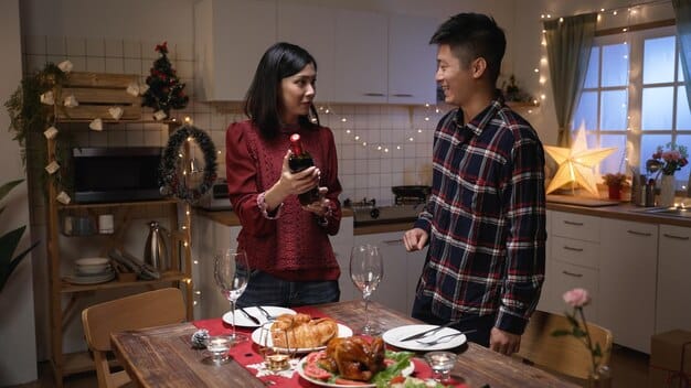 A happy Filipino family celebrating Christmas together, with a simple yet festive dinner spread on the table. They are all smiling and enjoying each other's company, emphasizing the importance of family during the holidays.
