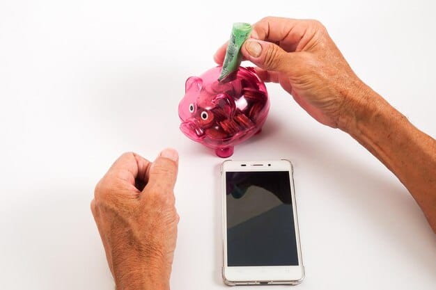 A person holding a smartphone displaying a savings app alongside a filled piggy bank, illustrating modern saving methods and financial technology.
