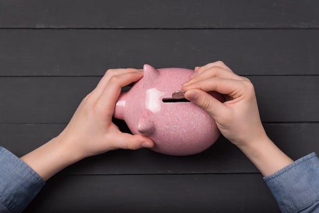 A close-up shot of a hand placing a coin into a piggy bank, symbolizing the act of saving and investing for retirement.