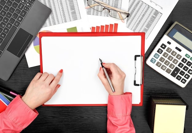 A person creating budget plan by writing on a paper with calculator and financial document placed on the table.