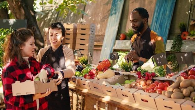 A Filipino family shopping in a local market, comparing prices of fresh produce and other goods. The scene should depict a scenario where they are making smart and economical choices, such as buying in bulk and opting for seasonal items.