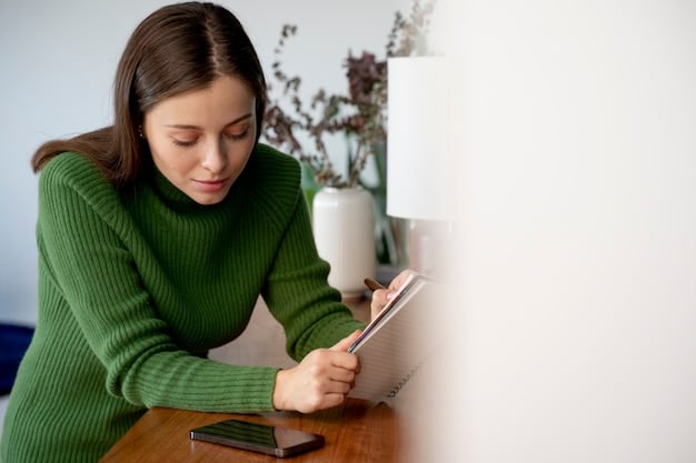A person writing down their expenses in a notebook, surrounded by receipts and bills, illustrating the importance of tracking expenses for budgeting.