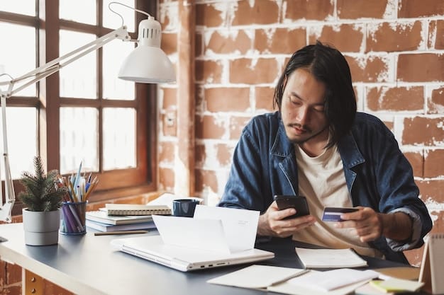 A young Filipino professional using a budgeting app on their smartphone, sitting at a desk with financial documents and a calculator.