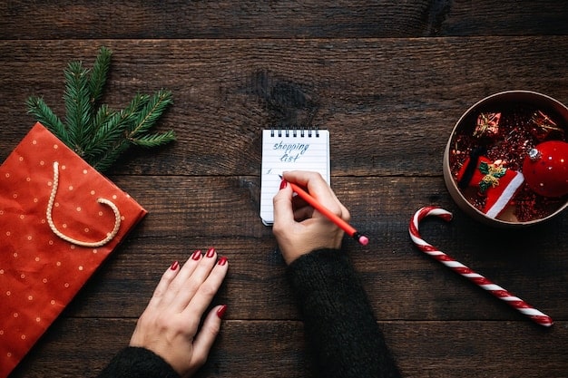 A close-up shot of a person's hands meticulously writing a Christmas shopping list in a festive notebook. The list includes specific gifts for family members and ingredients for traditional Filipino Christmas dishes.